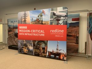 10' x 10' SOHO frame featuring multiple images of machines and oil rigs for a company